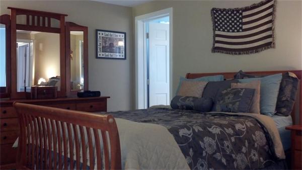 101 Gammons Road Acushnet, MA 02743 - Photo 12 of 29 a bedroom with a bed and wooden floor