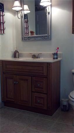 101 Gammons Road Acushnet, MA 02743 - Photo 10 of 29 a bathroom with a sink and a mirror