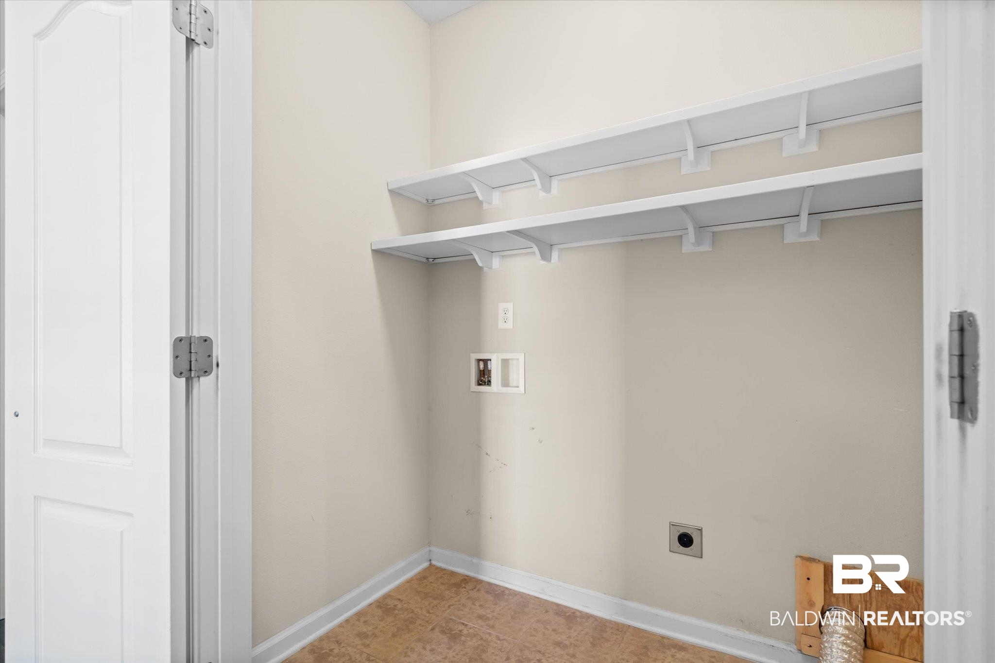 10251 Fionn Loop Daphne, AL 36526 - Photo 18 of 28 Clothes washing area featuring hookup for a washing machine, light tile patterned flooring, and hookup for an electric dryer
