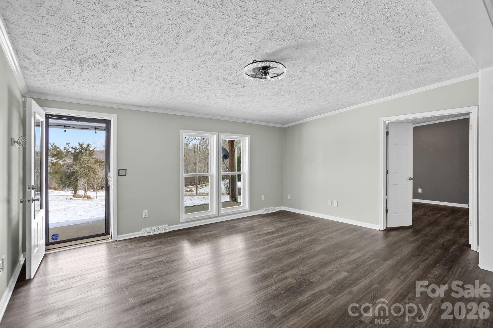 4855 Talley Road Walkertown, NC 27051 - Photo 10 of 45 a view of an empty room with wooden floor and a window