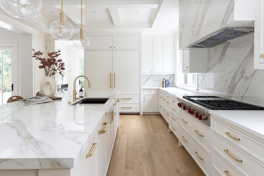 68 Clyde Street Brookline, MA 02445 - Photo 11 of 25 a kitchen with a stove a sink and a refrigerator