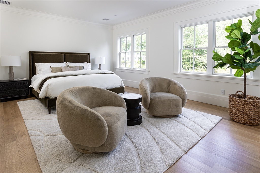 68 Clyde Street Brookline, MA 02445 - Photo 16 of 25 a bedroom with a bed and window