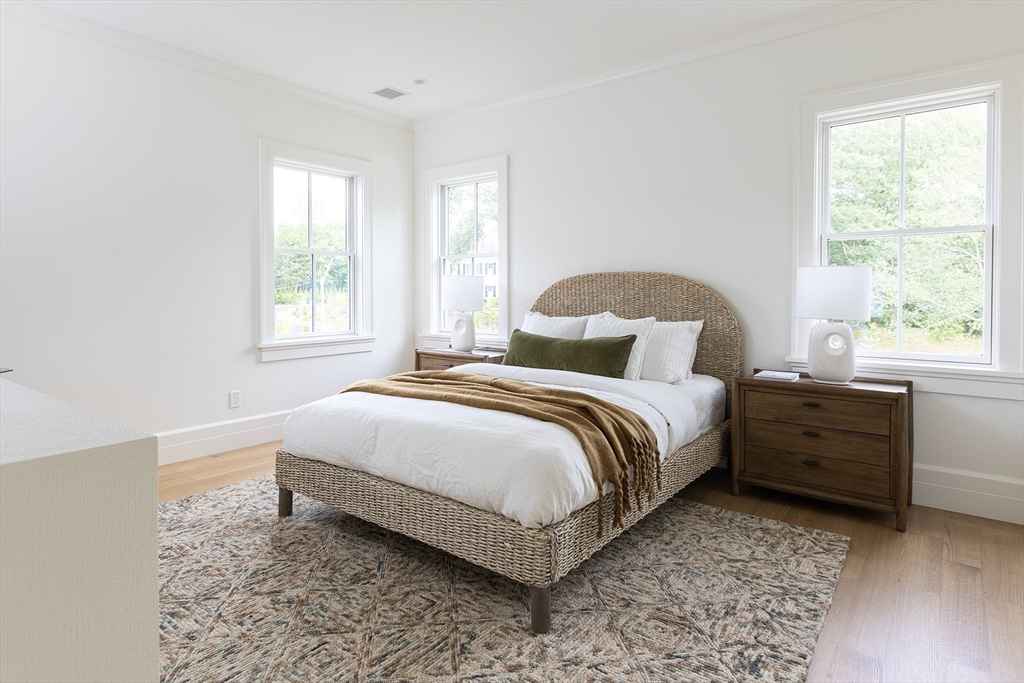 68 Clyde Street Brookline, MA 02445 - Photo 18 of 25 a bedroom with a bed and a window