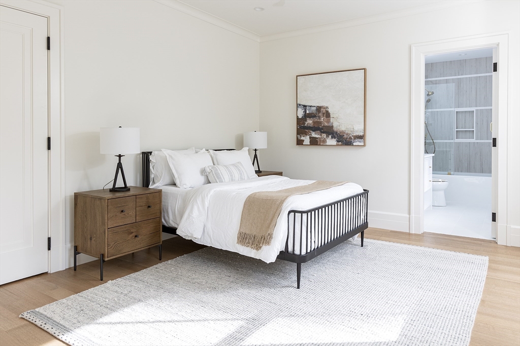 68 Clyde Street Brookline, MA 02445 - Photo 20 of 25 a bedroom with a bed and a night stand