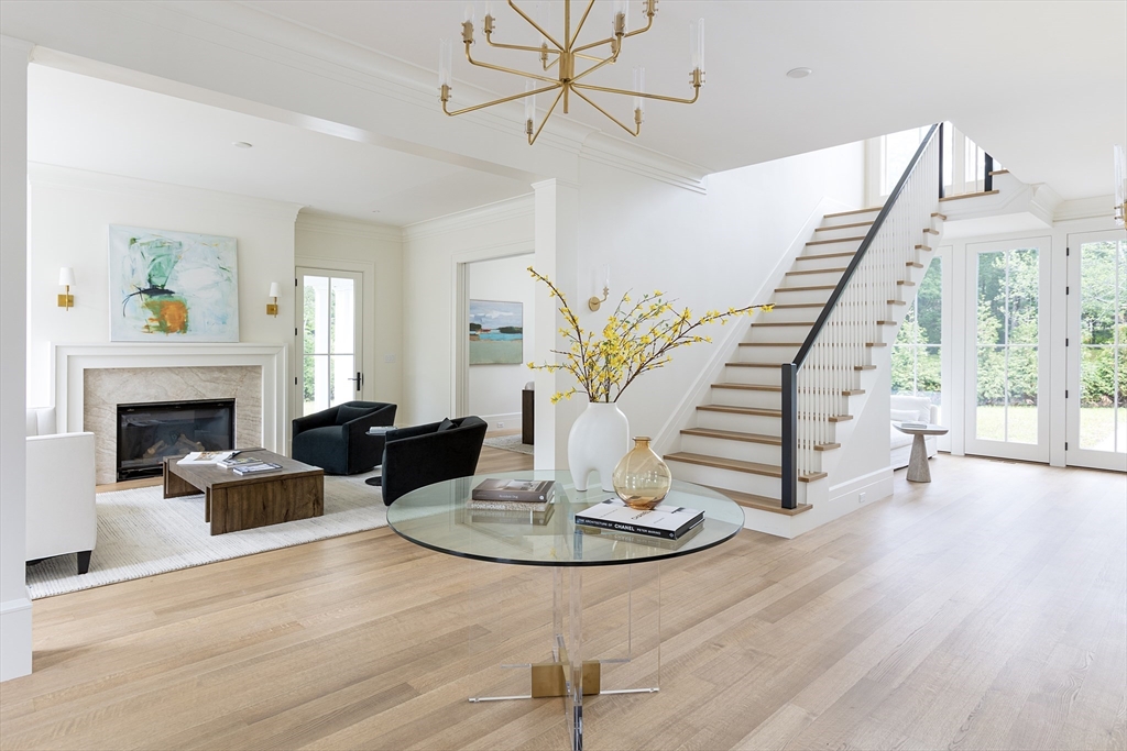 68 Clyde Street Brookline, MA 02445 - Photo 2 of 25 a living room with furniture and a fireplace