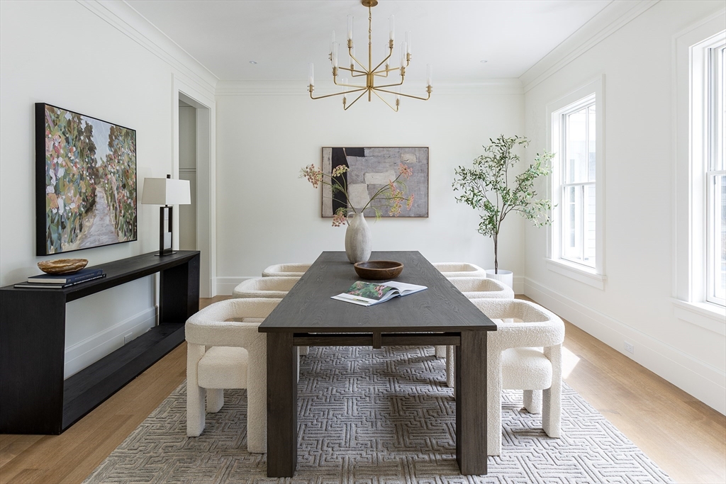 68 Clyde Street Brookline, MA 02445 - Photo 6 of 25 a table room with a table chairs and a window