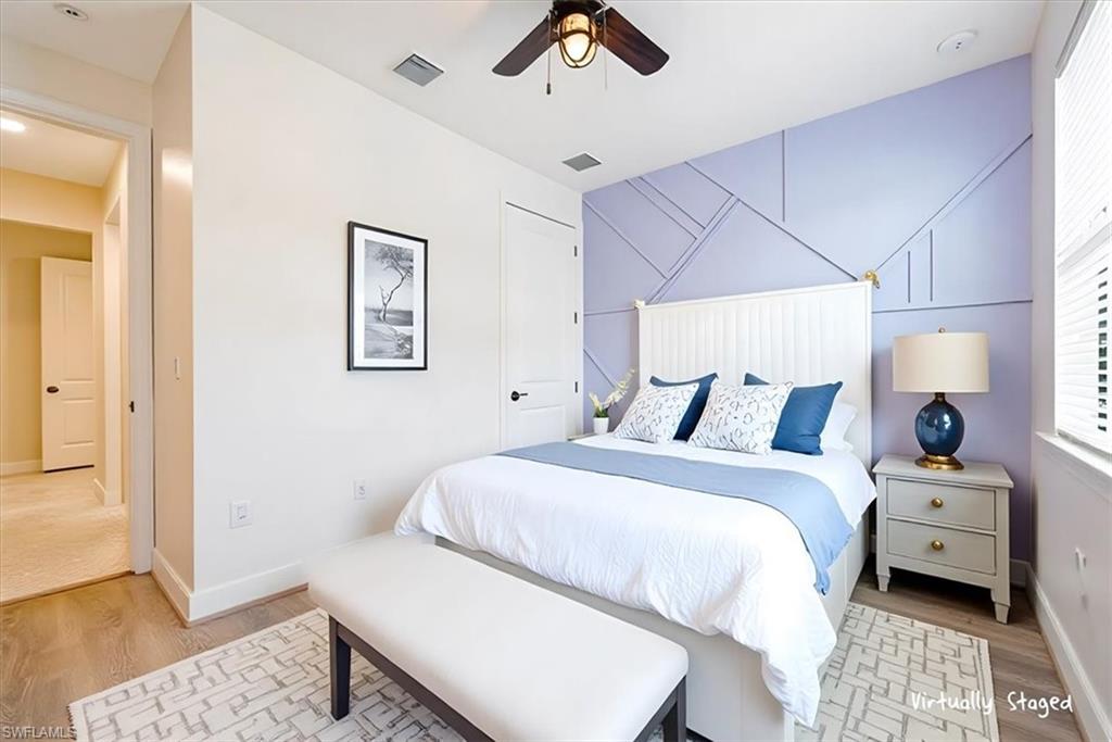 1996 Parson Street Naples, FL 34120 - Photo 14 of 50 Bedroom with light wood-type flooring and a ceiling fan