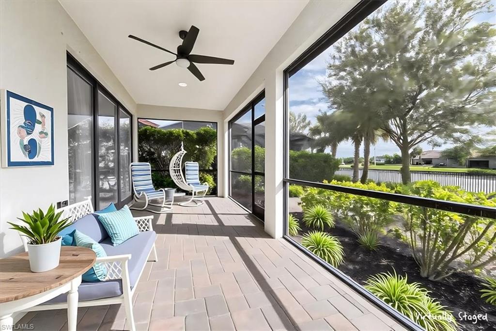 1996 Parson Street Naples, FL 34120 - Photo 36 of 50 Sunroom / solarium featuring a water view