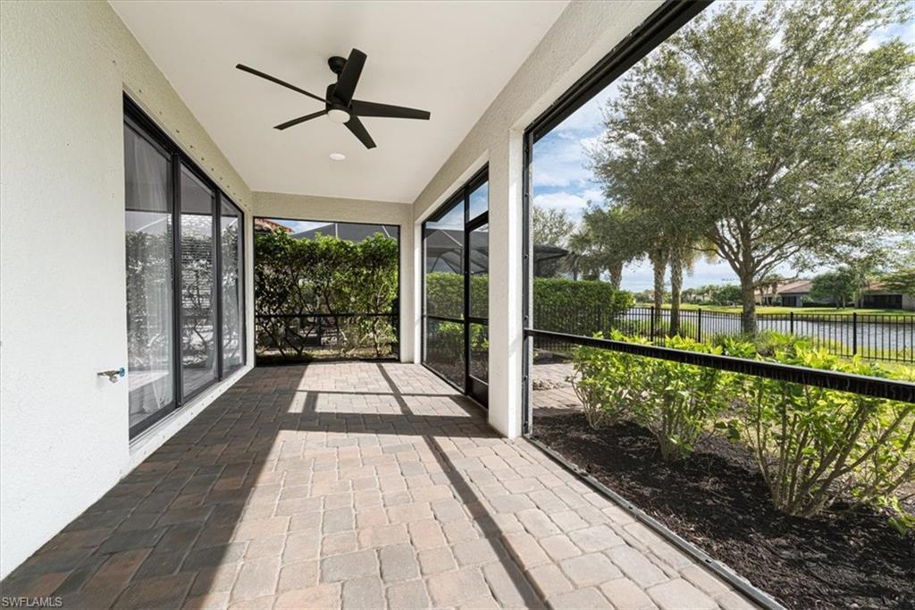 1996 Parson Street Naples, FL 34120 - Photo 37 of 50 Unfurnished sunroom featuring ceiling fan and a water view