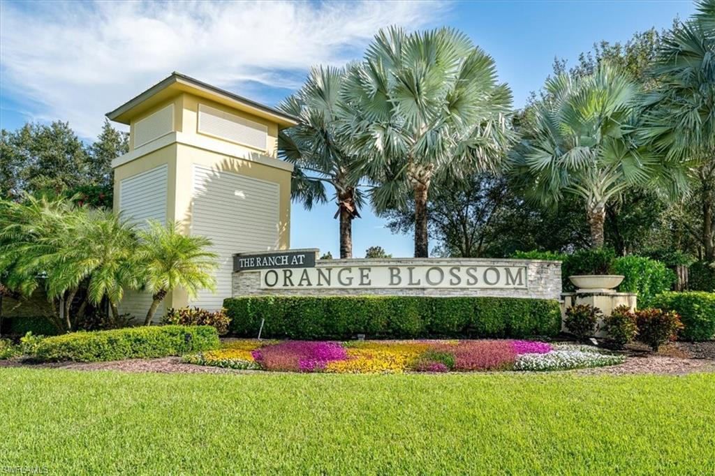 1996 Parson Street Naples, FL 34120 - Photo 42 of 50 Community / neighborhood sign with a lawn