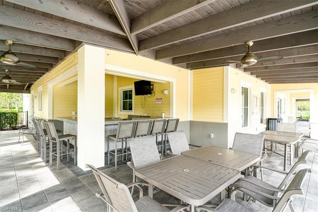 1996 Parson Street Naples, FL 34120 - Photo 43 of 50 View of patio with ceiling fan and outdoor dining area