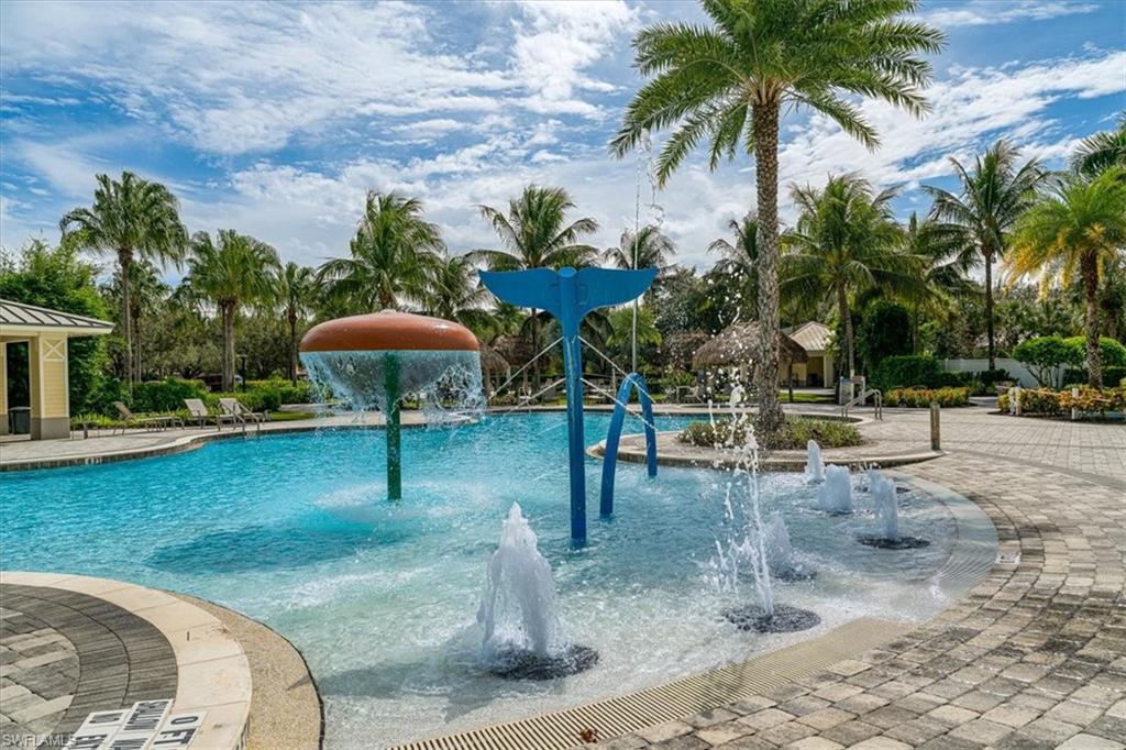1996 Parson Street Naples, FL 34120 - Photo 47 of 50 Community pool featuring a water play area and a patio area