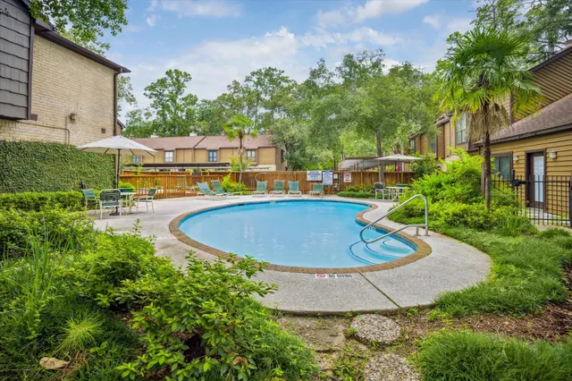 a view of a swimming pool with a patio