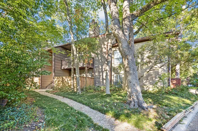 a view of house with a trees