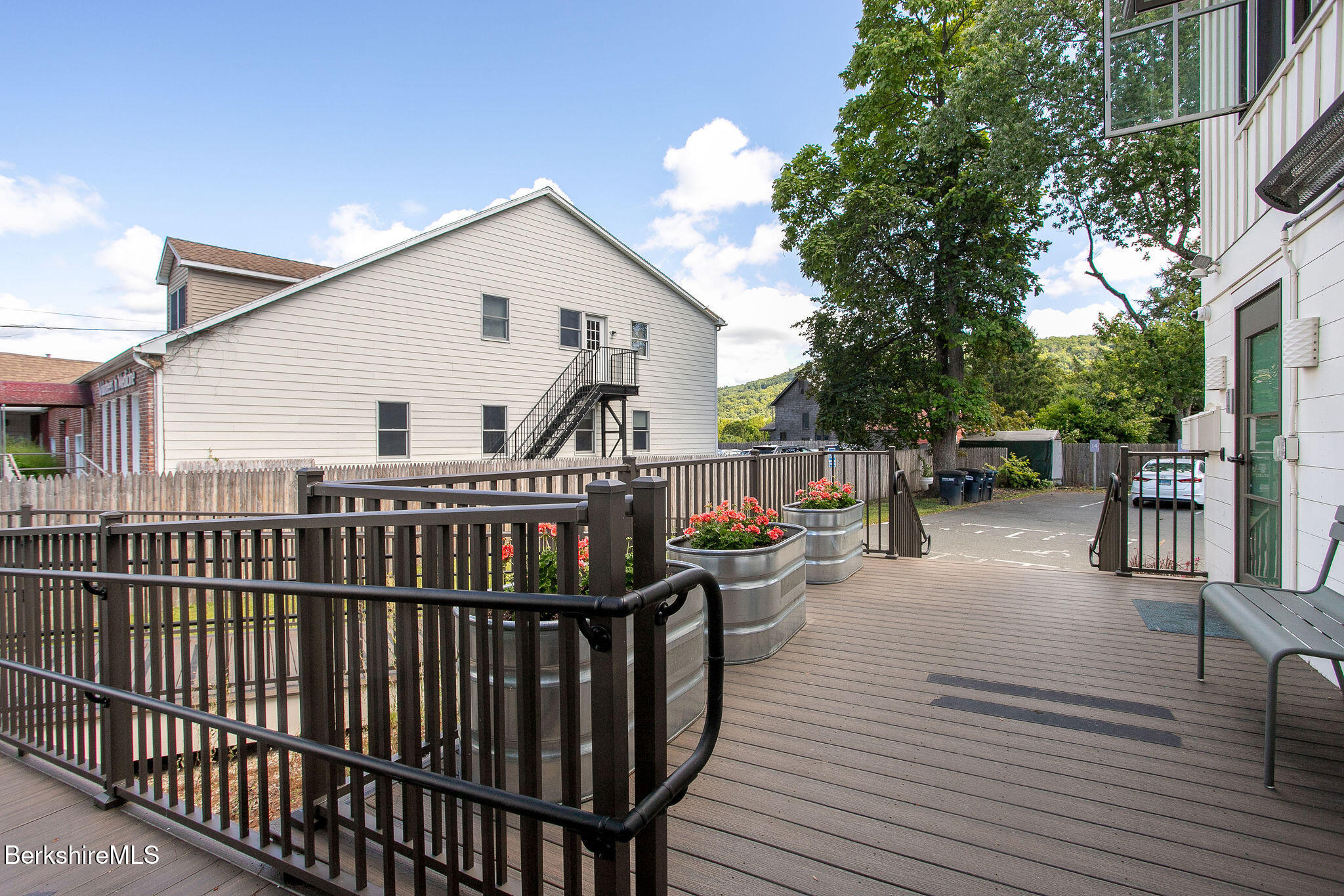 783 Main Street Great Barrington, MA 01230 - Photo 25 of 31 a view of a house with wooden deck and furniture