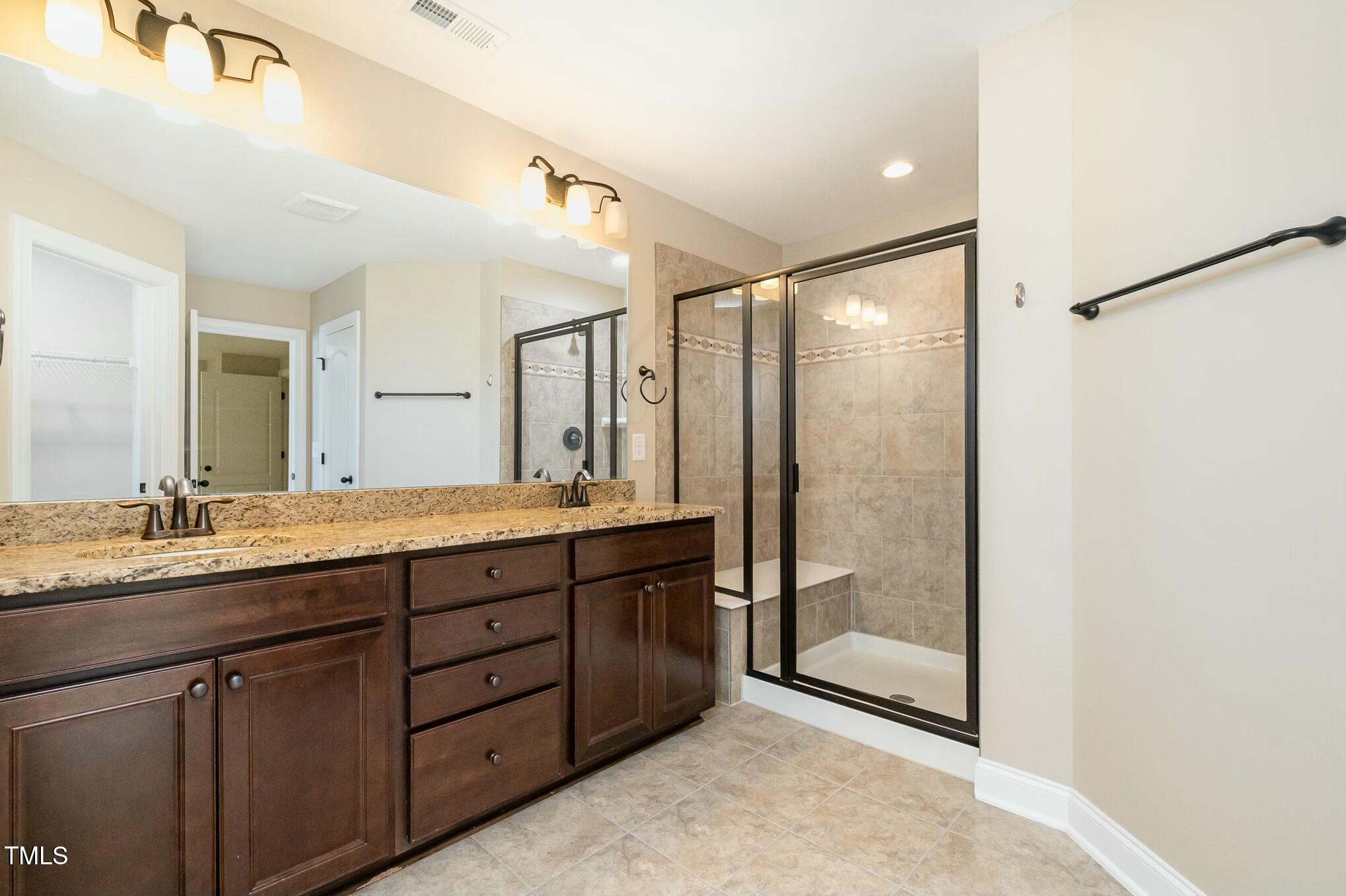 1335 Catch Fly Lane Durham, NC 27713 - Photo 18 of 30 a bathroom with a granite countertop sink mirror and double