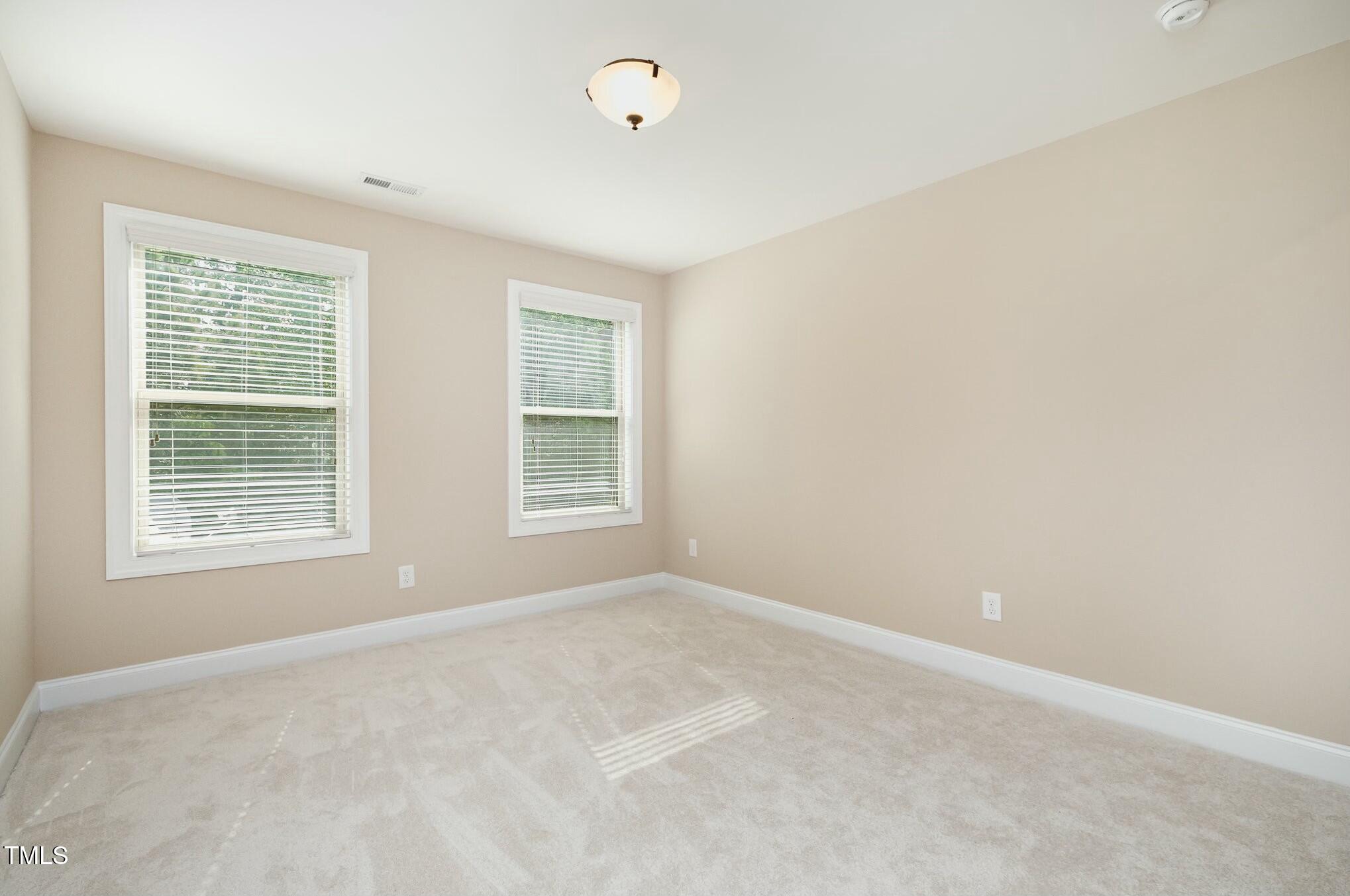 1335 Catch Fly Lane Durham, NC 27713 - Photo 20 of 30 an empty room with a window