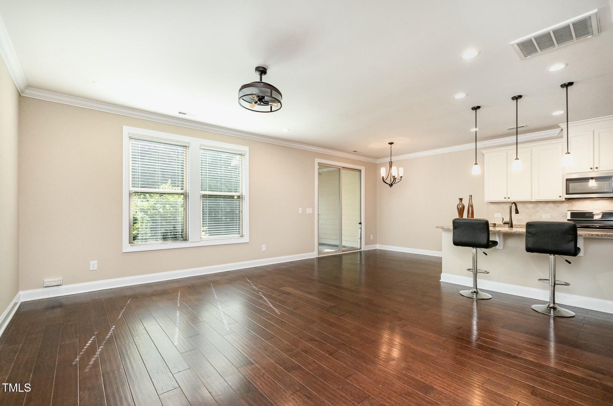 1335 Catch Fly Lane Durham, NC 27713 - Photo 6 of 30 a view of a room with a window and wooden floor