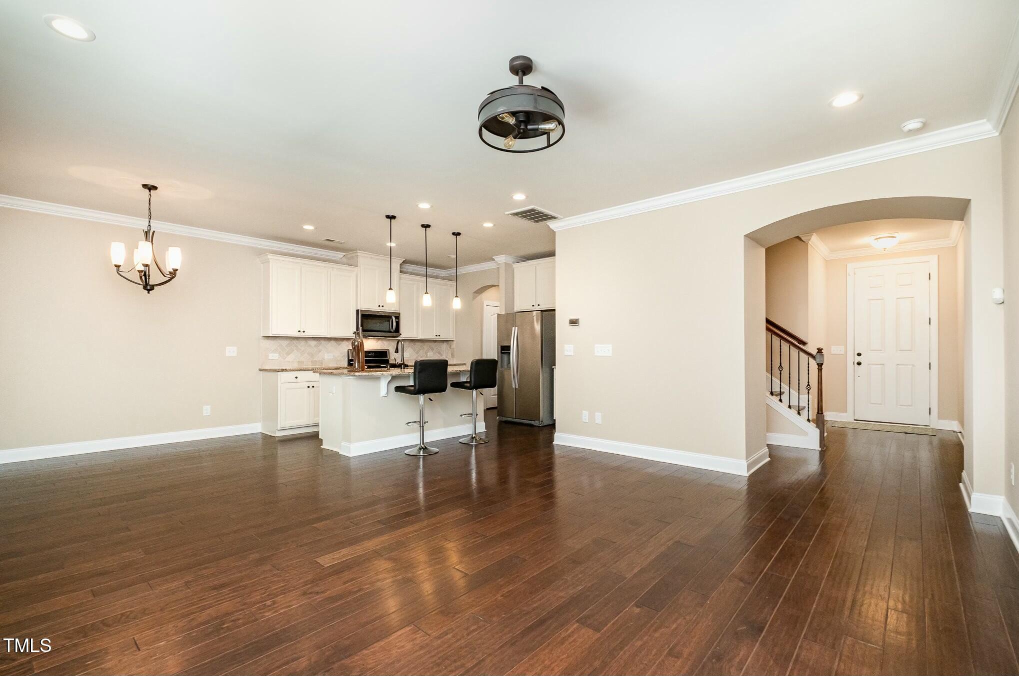 1335 Catch Fly Lane Durham, NC 27713 - Photo 7 of 30 a view of kitchen with furniture and wooden floor