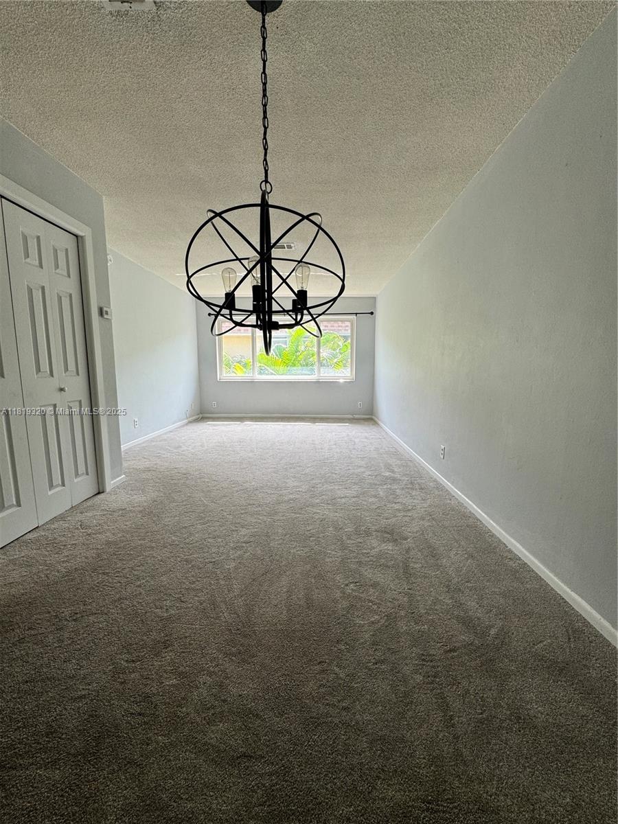 2701 Northeast 1st Street, Unit 203 Pompano Beach, FL 33062 - Photo 16 of 16 a view of an empty room with a window
