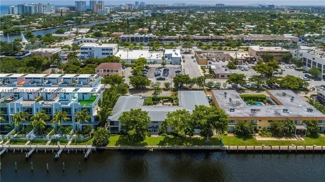 an aerial view of residential houses with outdoor space