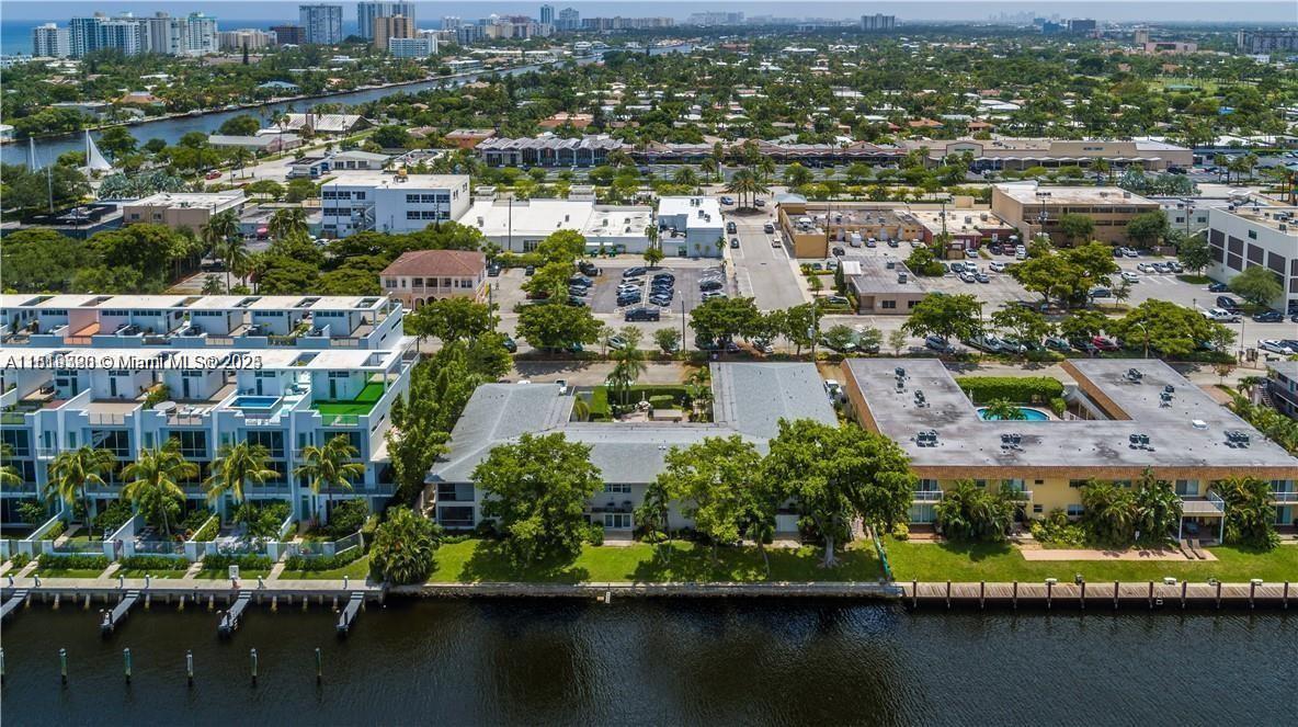 2701 Northeast 1st Street, Unit 203 Pompano Beach, FL 33062 - Photo 2 of 16 an aerial view of residential houses with outdoor space