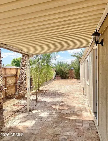a view of a backyard with a patio