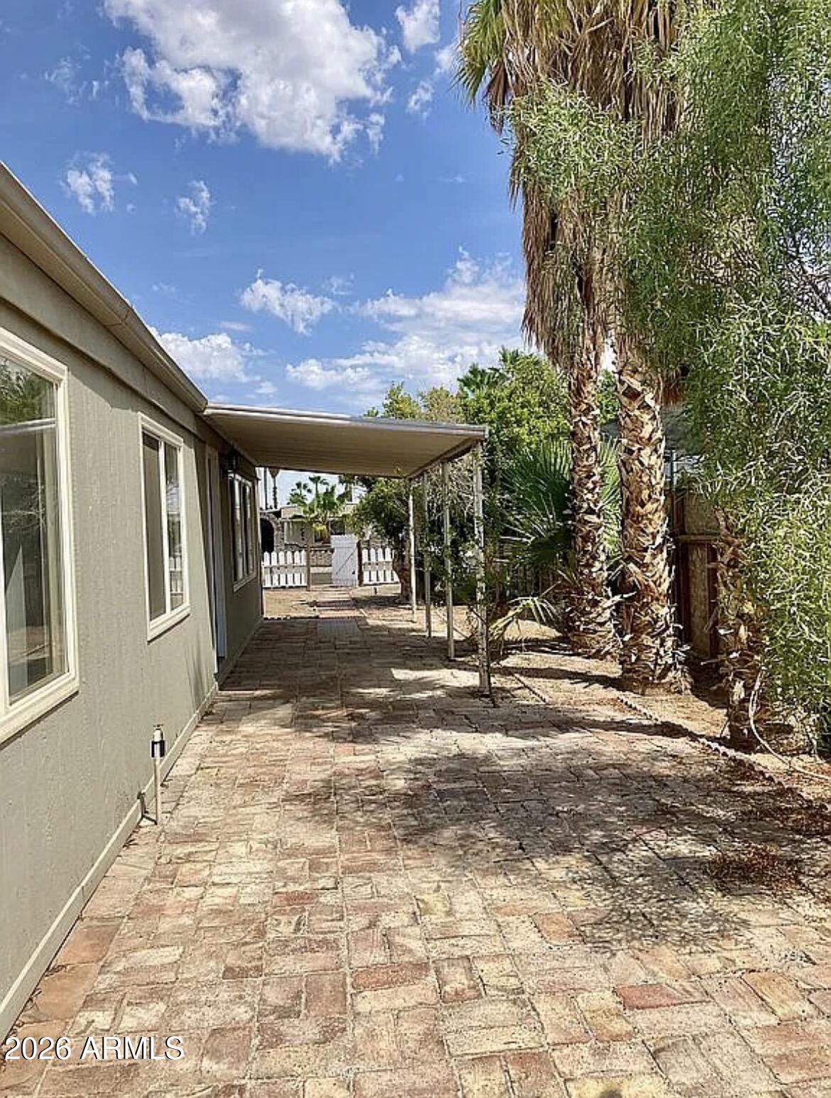 13245 East 39th Way Yuma, AZ 85367 - Photo 20 of 24 a view of backyard with large trees and plants