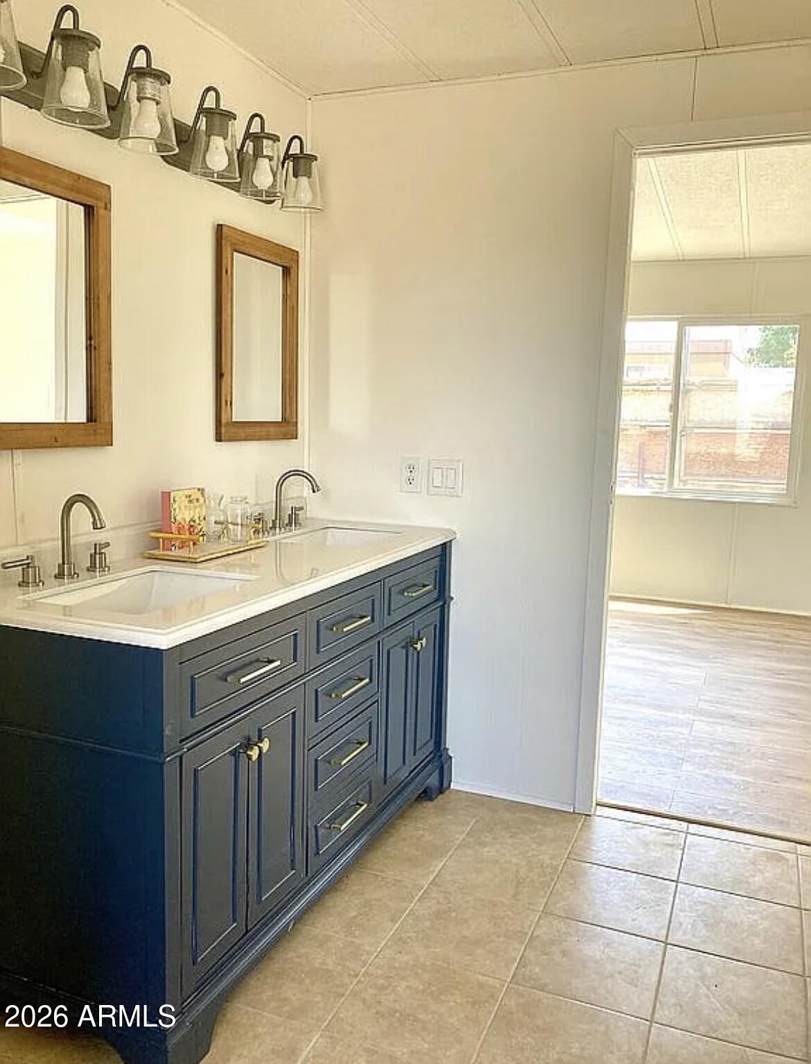 13245 East 39th Way Yuma, AZ 85367 - Photo 21 of 24 a bathroom with a sink double vanity and a mirror