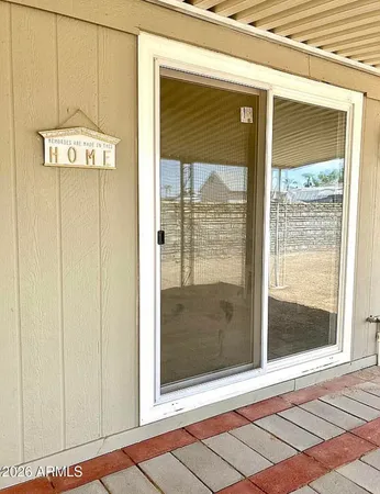 a view of a door and a window
