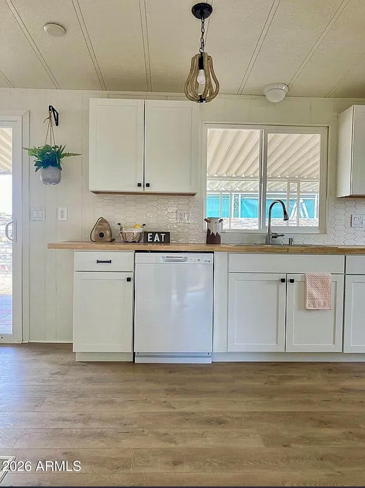 13245 East 39th Way Yuma, AZ 85367 - Photo 6 of 24 a kitchen with stainless steel appliances granite countertop a sink a stove cabinets counter space and a window