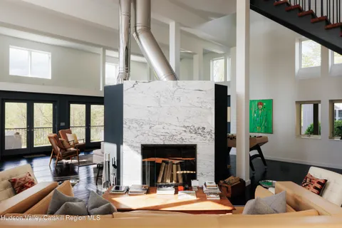 a kitchen with a sink and a large window
