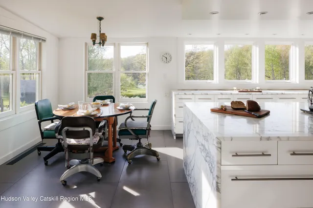 a view of a dining room with furniture window and outside view