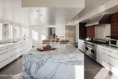 a living room with furniture a window and wooden floor