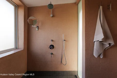 a view of a swimming pool with lounge chairs