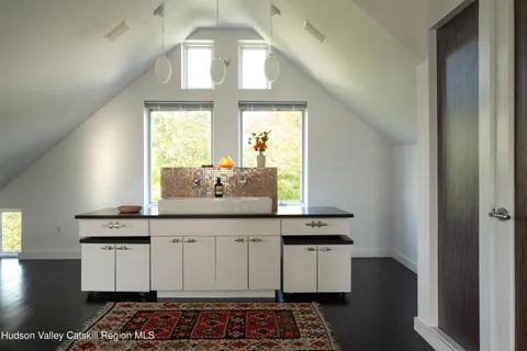 a view of a multi story residential apartment building with a yard