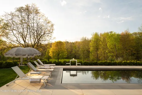 a view of a garden with large trees