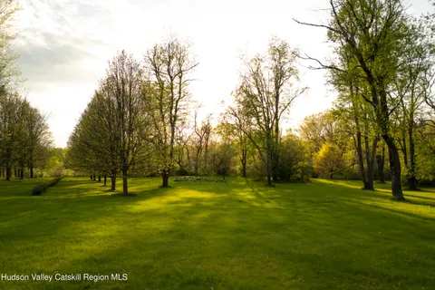 an aerial view of residential houses with lake view