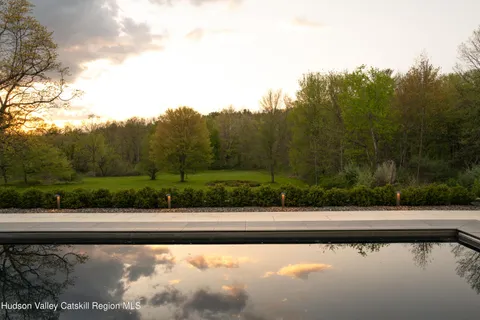 a view of a ocean with a mountain in the back