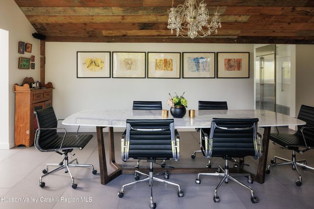 a view of a workspace with furniture