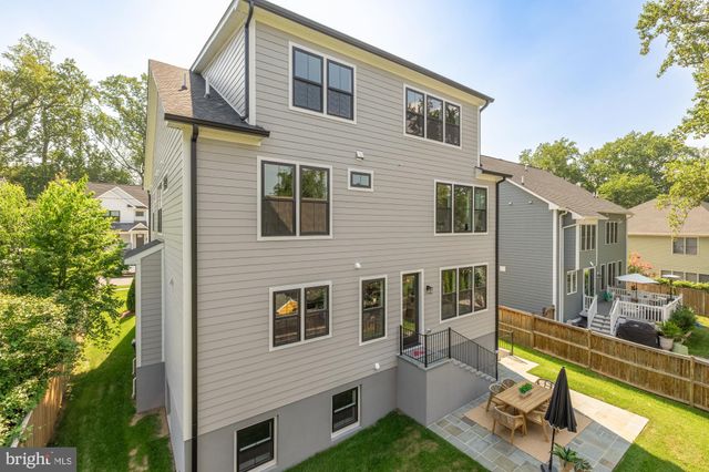 a view of a house with a yard and balcony