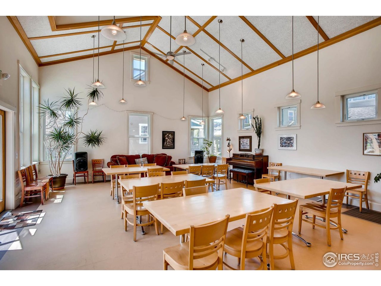 193 2nd Avenue, Unit A Lyons, CO 80540 - Photo 20 of 40 a living room with lots of furniture and a chandelier