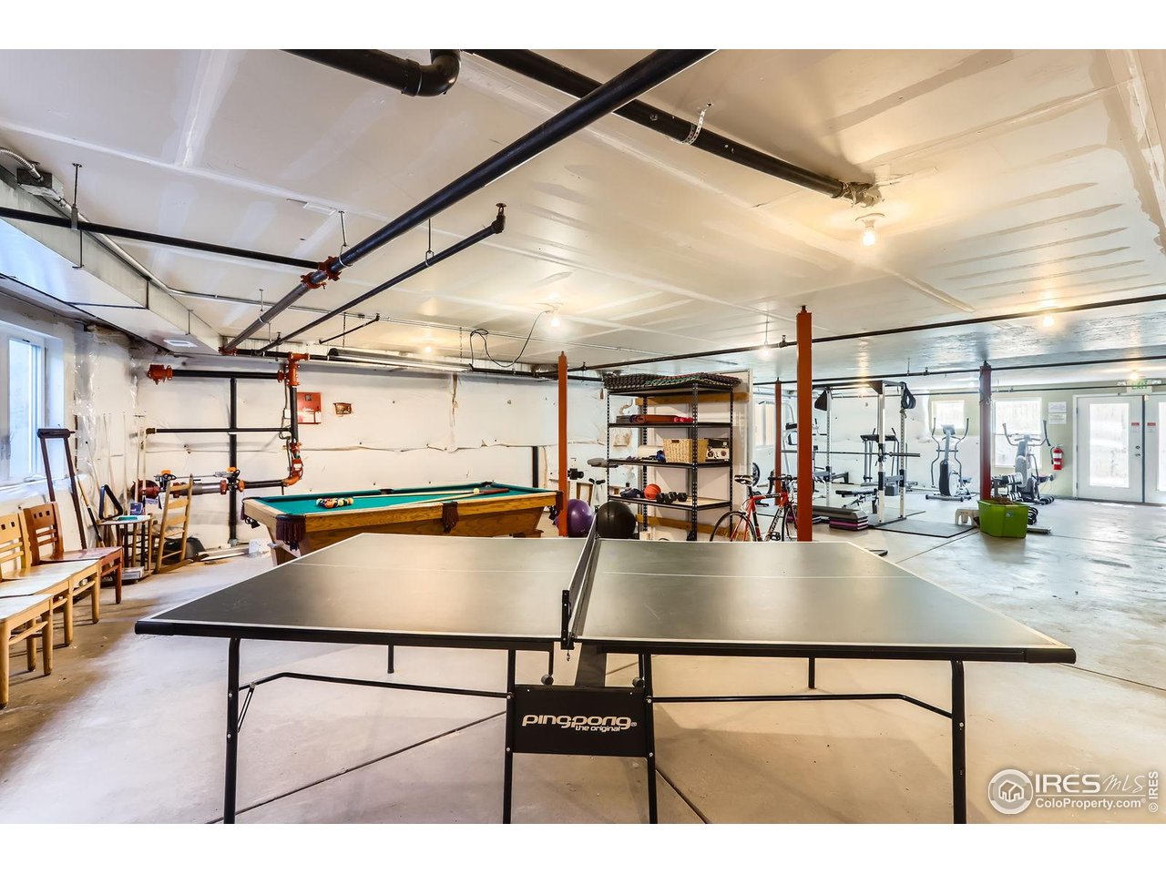 193 2nd Avenue, Unit A Lyons, CO 80540 - Photo 25 of 40 a view of a swimming pool with a patio