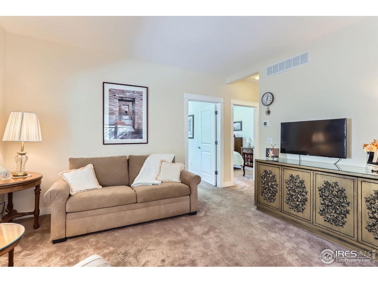 193 2nd Avenue, Unit A Lyons, CO 80540 - Photo 7 of 40 a living room with furniture and a flat screen tv