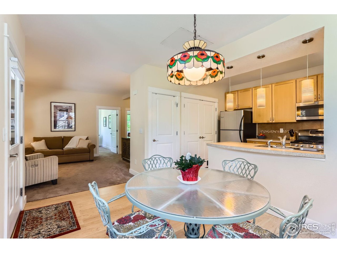193 2nd Avenue, Unit A Lyons, CO 80540 - Photo 9 of 40 a living room with furniture and a table