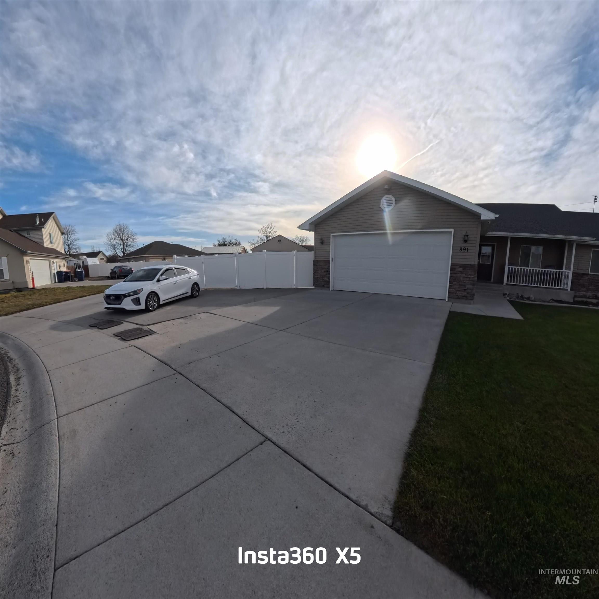 891 North Pointe Drive Twin Falls, ID 83301 - Photo 2 of 46 View of home's exterior featuring concrete driveway and covered porch