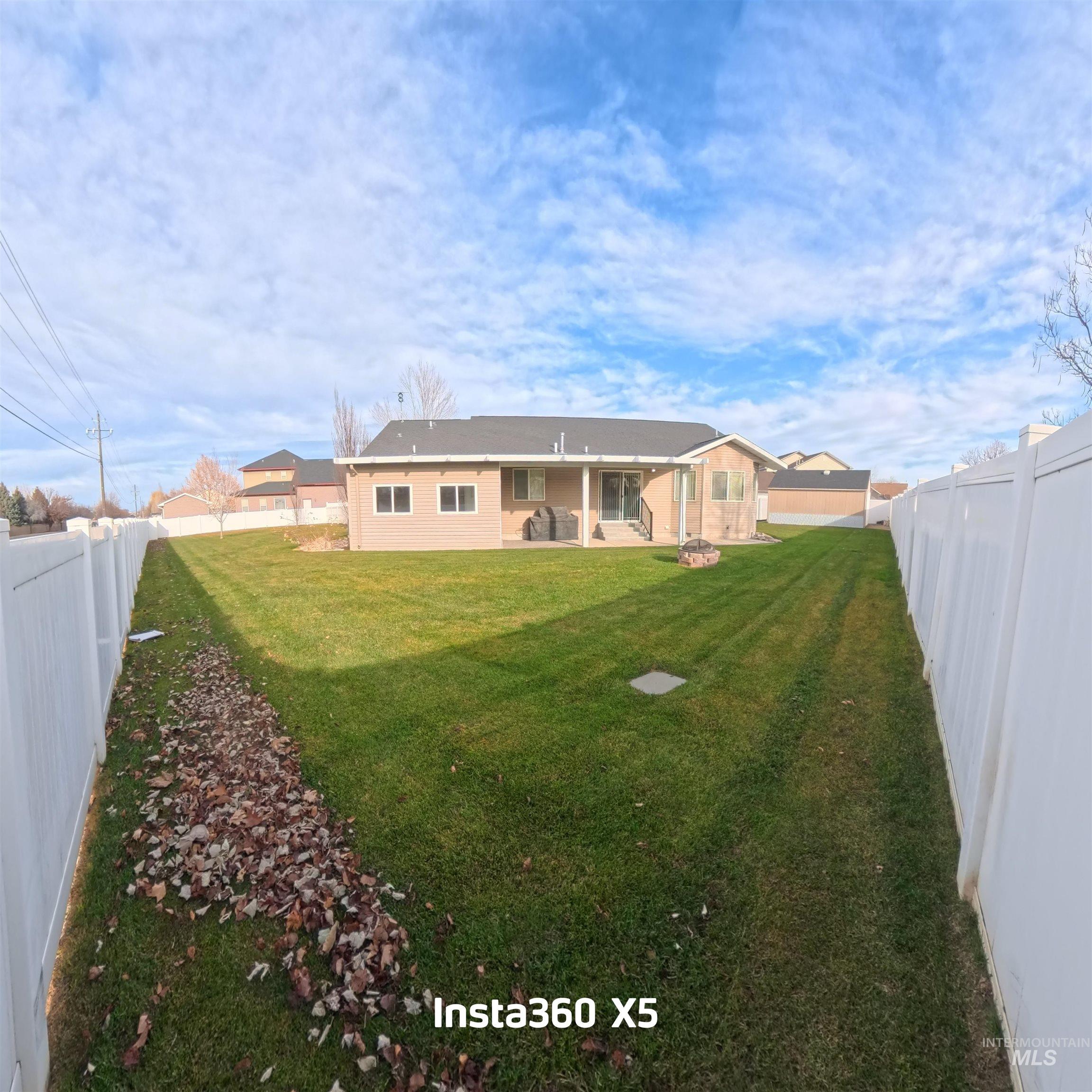 891 North Pointe Drive Twin Falls, ID 83301 - Photo 5 of 46 Back of property featuring a fenced backyard and a patio