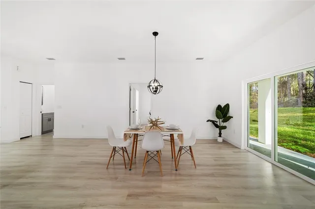 a view of a room with furniture window and wooden floor