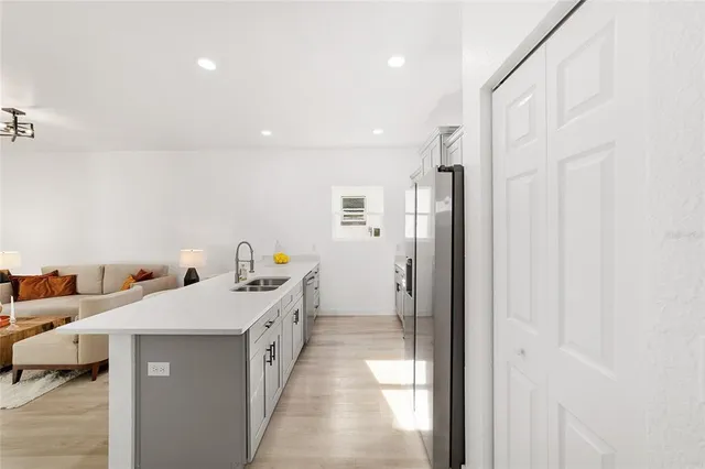 a en suite bathroom with a double vanity sink and mirror