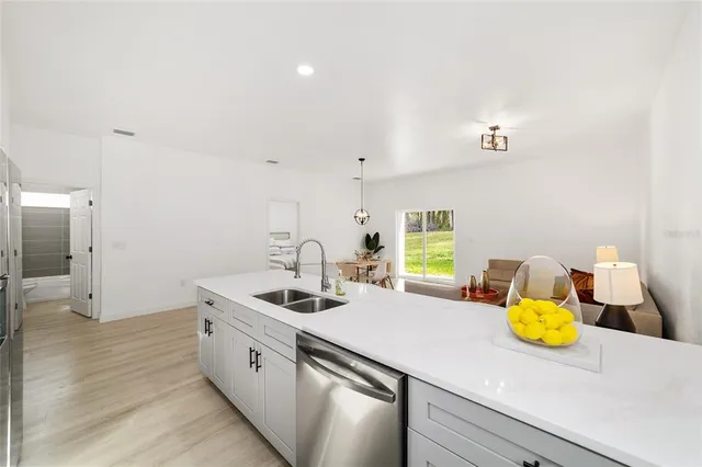 a kitchen with sink and a stove
